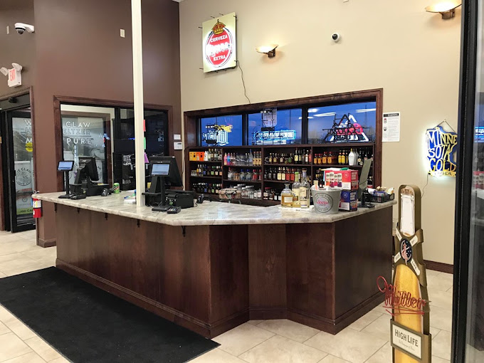 O'Brothers Wine and Spirits store interior with premium shelving and warm lighting